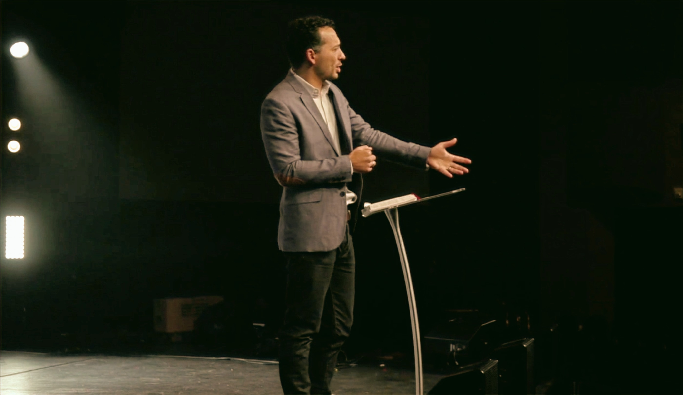 Caleb preaching from an open Bible